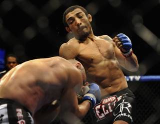 Jose Aldo throws a right uppercut toward Manny Gamburyan during their featherweight title fight at WEC 51 on Sept. 30, 2010, at 1st Bank Center in Broomfield, Colo. Aldo won by TKO in the second round.