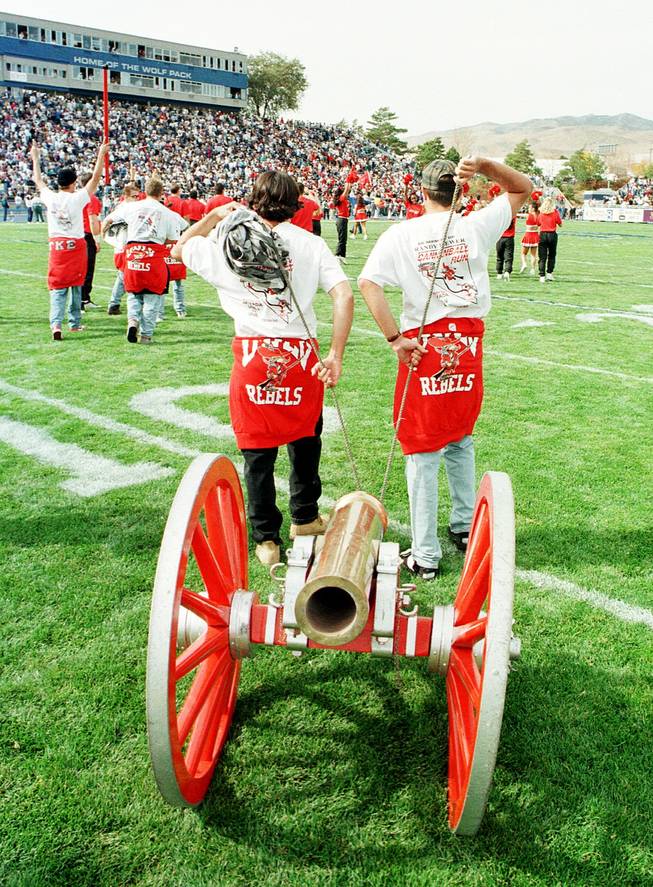 UNLV students pull the Fremont Cannon onto the field at UNR on Oct. 28, 1995, after UNR regained possession of the cannon in a 55-32 win. Pre- and post-game incidents marred the contest.