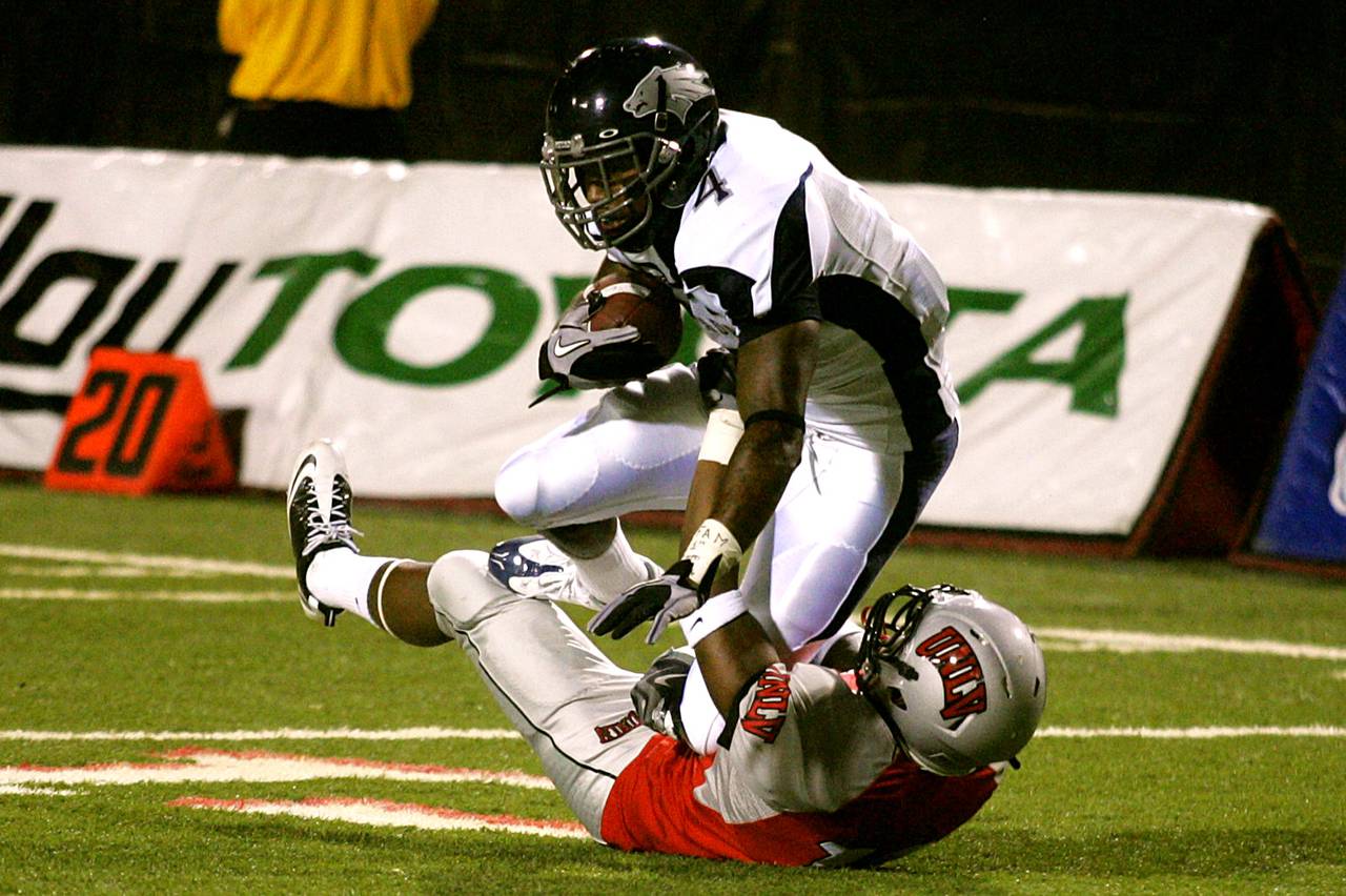 UNR quarterback Colin Kaepernick runs it through the UNLV defense