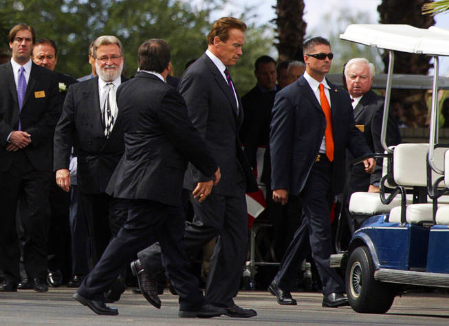 Actor and California Governor Arnold Schwarzenegger, center, leaves after speaking at a memorial service for actor Tony Curtis at Palm Mortuary and Cemetery in Henderson October 4, 2010. Curtis died Wednesday at his home. He was 85-years-old.