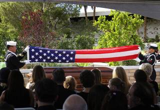 Members of a U.S. Navy honor guard fold the flag that covered the casket of Tony Curtis during the funeral for the actor at Palm Mortuary and Cemetery in Henderson October 4, 2010. Curtis died Wednesday at his home. He was 85-years-old.