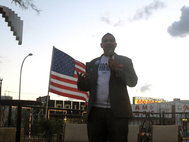 Derek Washington, chairman of the Stonewall Democratic Club of Southern Nevada, speaks to a crowd Monday night for the Bully-Free Zone Rally outside of the Arts Factory on East Charleston Boulevard.  