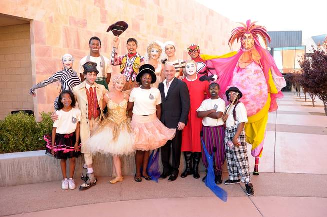 Andre Agassi poses for photographs with members of Cirque du ...