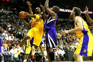 Kobe Bryant of the Los Angeles Lakers drives past Carl Landry of the Sacramento Kings during a preseason game Wednesday at the Thomas & Mack Center. The Lakers won the game 98-85.