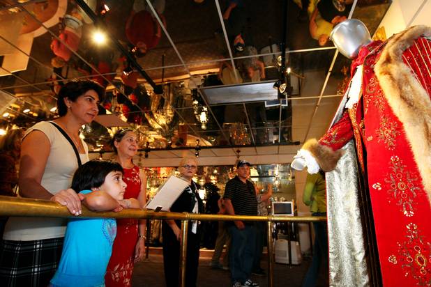 Rose Matin, 5, gazes at a rhinestone-studded costume of Liberace's while visiting the Liberace Museum with her mom, Nahid, and aunt, Maggie, right, Sunday, in Las Vegas.