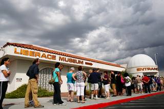 Fans wait in line to enter the Liberace Museum on its final day of business after 31 years of operation in Las Vegas, Sunday, October 17, 2010.