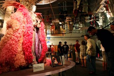 Fans admire the feathered capes and bejeweled costumes of Liberace while visiting the Liberace Museum during its final hours of business Sunday, October 17, 2010, after 31 years in Las Vegas.