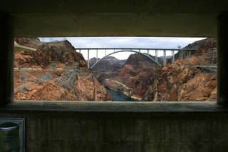 The recently opened Mike O'Callaghan-Pat Tillman Memorial Bridge is framed by the Hoover Dam Wednesday, October 20, 2010.