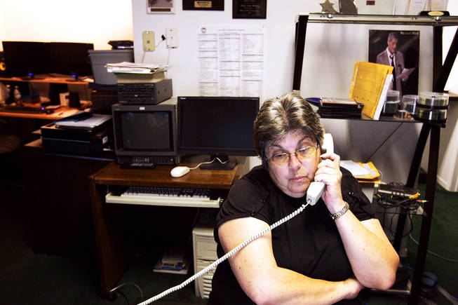 Boulder City public information officer Rose Ann Miele talks on the phone inside her office in Boulder City Thursday, October 21, 2010. December 1 will be Miele's last day on the job.