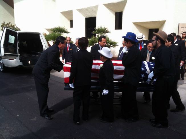 Pallbearers prepare to place Edmundo "Eddie" Escobedo's casket in a hearse following a memorial service Saturday at Palm Mortuary in downtown Las Vegas.