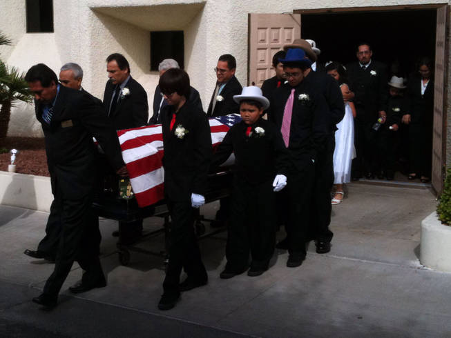 Pallbearers bring Edmundo "Eddie" Escobedo's casket out of the chapel following a memorial service Saturday at Palm Mortuary in downtown Las Vegas.