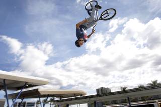 BMX stunt rider Jose Donoso, 31, performs a flip during a ceremony marking the completion of the Bonneville Transit Center in downtown Las Vegas Monday, October 25, 2010. The facility will serve as the central hub for the RTC's transit services, including the Strip & Downtown Express, the Deuce on the Strip, Centennial Express, MAX and 12 other routes.