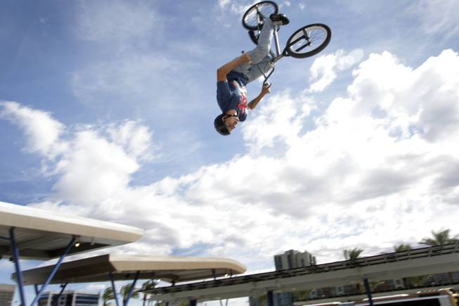 BMX stunt rider Jose Donoso, 31, performs a flip during ...