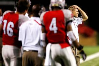 UNLV head coach Bobby Hauck puts his hand on his head during the second half of their game against Saturday, October 30, 2010. Fourth-ranked TCU won the game 48-6.
