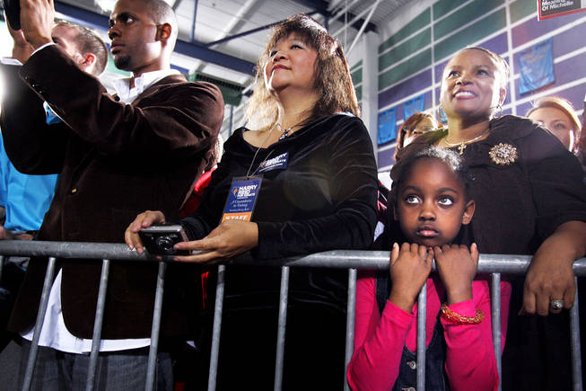 Supporters look on during a rally for Sen. Harry Reid with First Lady Michelle Obama at Canyon Springs High School in North Las Vegas Monday, November 1, 2010.