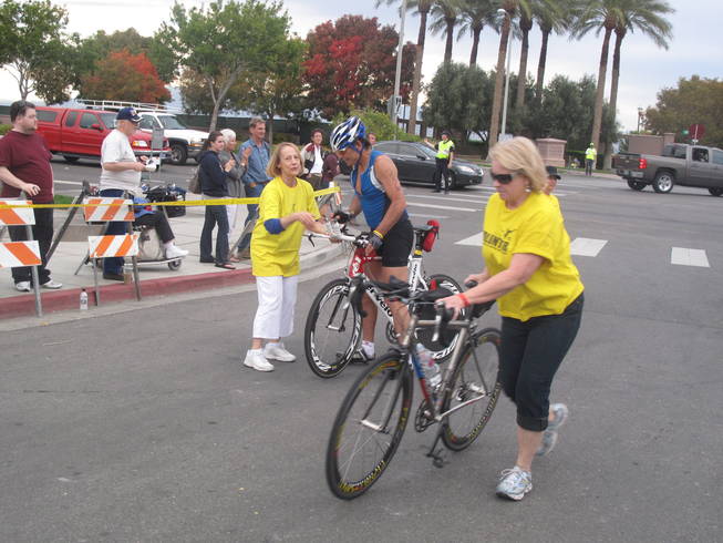 Volunteers escorted the athletes' bikes to a holding area after they completed the biking portion of the triathlon. About 1,100 people participated in various races at the sixth-annual Nevada Silverman Triathlon in Henderson on Sunday.
