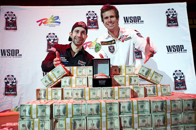 World Series of Poker Main Event finalists Jonathan Duhamel, 22, of Montreal, Canada, and John Racener, 24, of Port Richey, Fla. pose during a news conference at the Rio Sunday, November 7, 2010. The pair will play for a championship bracelet and a $8.9 million first prize at the Rio Monday.