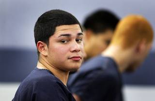 Daniel Carrillo, 16, waits to make an initial appearance in Las Vegas Justice Court Monday, November 15, 2010. Carrillo is one of the six people charged with murder and robbery in the death of Eldorado High School teacher Timothy VanDerbosch.