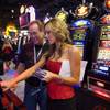 Melanie James of Bally Technologies shows a Playboy slot machine to Will Grubb, a business development manager for Avnet Electonics Marketing, during the Global Gaming Expo (G2E) at the Las Vegas Convention Center Tuesday, November 16, 2010. 
