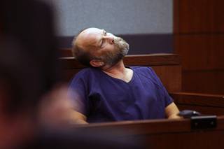 Mark Douglas Franta, 50, husband of Las Vegas teacher Marybeth Franta, stretches his neck as he waits to make an appearance in District Court Monday, Nov. 22, 2010. Franta is charged with his wife's murder.