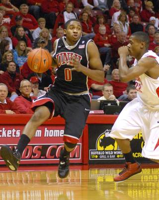 UNLV's Oscar Bellfield (0) drives around Illinois State's Kenyon Smith during Wednesday's game in Normal, Ill.