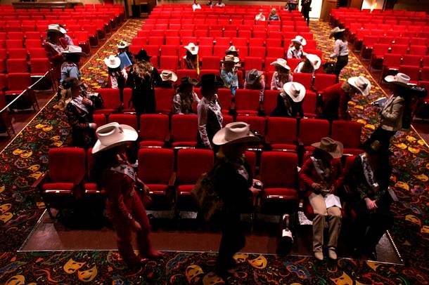 Miss Rodeo contestants take a break as they rehearse for the Miss Rodeo America Pageant on Wednesday, Dec. 1, 2010.