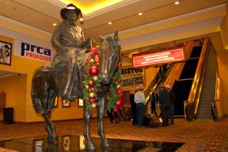 A statue of Benny Binion, a key figure in bringing the National Finals Rodeo to Las Vegas, stands at the entrance to the NFR welcome reception at South Point on Tuesday, Nov. 30, 2010.