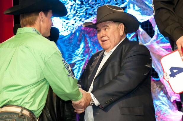 South Point owner and National Finals Rodeo sponsor Michael Gaughan welcomes competitors onstage during the NFR welcome reception at South Point on Tuesday, Nov. 30, 2010.
