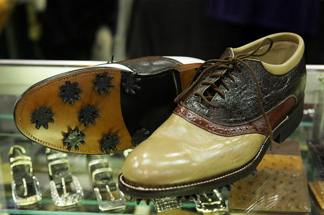 Custom-made golf shoes ($750) are displayed at the Loveless Custom Boots and Shoes booth during the Cowboy Christmas Gift Show at the Las Vegas Convention Center on Dec. 3, 2010. The show, affiliated with the Wrangler National Finals Rodeo, runs through Dec. 11.