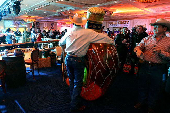 A man who preferred to remain anonymous dances with an inflatable bottle of Crown Royal at the Gold Coast's Buck AoN Ball Sunday, December 5, 2010.