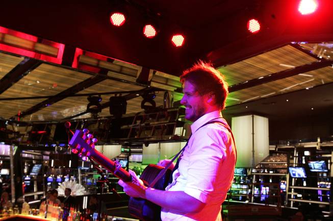 Nick Motile rehearses at Book & Stage, a combo sports book and entertainment venue. 