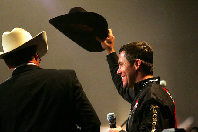 All-around world champion Trevor Brazile doffs his hat during the NFR World Champion Awards Show and After Party at The Mirage on Saturday, Dec. 11, 2010.