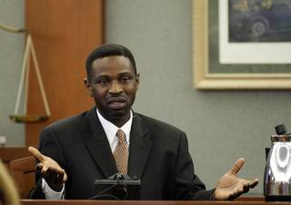 Victor Fakoya testifies on his own behalf during his trial at the Regional Justice Center Thursday, Dec. 16, 2010. 