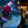 Bryson Drescher, 3, and his mother Jenny Drescher of Laughlin visit with an underwater Santa Claus swimming in a 117,000-gallon aquarium at the Silverton hotel-casino Sunday, December 19, 2010. Santa was equipped with a microphone so that he could communicate with the children.