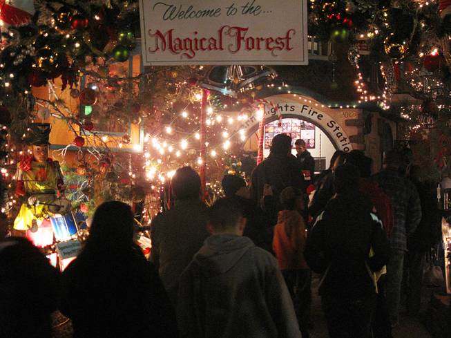 A crowd waits in line for the Northern Lights Fire Station at Opportunity Village's Magical Forest Thursday night. The attraction reopened Thursday at 5:30 p.m. after being forced to close several days due to heavy rainfall.