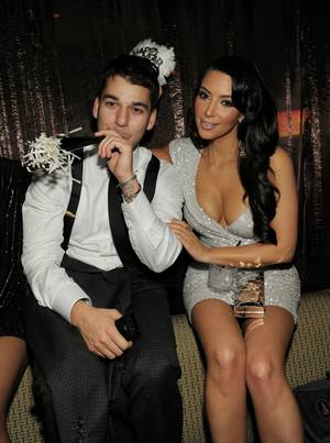 Kim Kardashian, with brother Rob Kardashian, hosts New Year's Eve at Tao at The Venetian on Dec. 31, 2010.