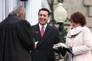 Gov. Brian Sandoval takes the oath of office from Chief Supreme Court Justice Michael Douglas during the inauguration, Jan. 3, 2011 at the Capitol in Carson City. First Lady Kathleen Sandoval is at right.