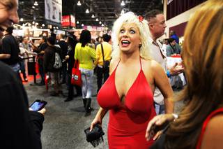 Adult film star Caudia Marie talks with fans at the AVN Adult Entertainment Expo at the Sands Convention Center in Las Vegas Friday, January 7, 2011.