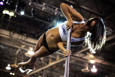 Alex from Sapphire Gentlemen’s Club competes in the pole dancing competition at the AVN Adult Entertainment Expo at the Sands Convention Center in Las Vegas on Friday, Jan. 7, 2011.