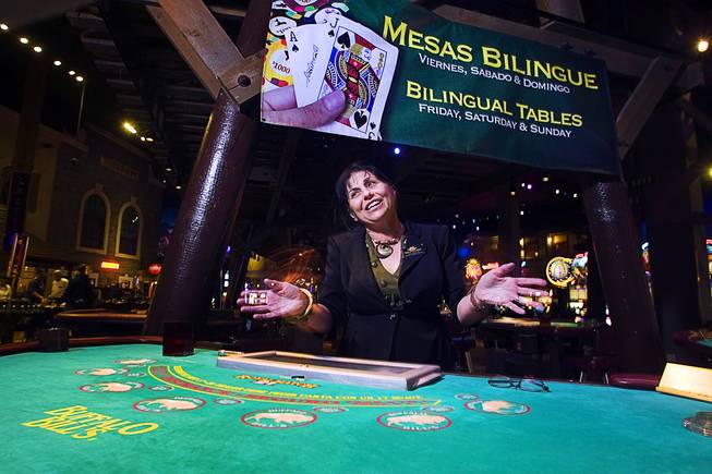Maria Macedo, games supervisor, talks about the success of the new bilingual (English and Spanish) blackjack tables at Buffalo Bills Casino in Primm Thursday, January 13. 2011. Customer volume is low during the week but the Primm casinos fill up during the weekend, especially if there is a Hispanic star performing at the concert hall, said Stuart Richey, vice president of marketing for the Primm Valley Casino Resorts.