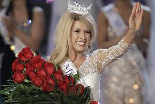 Miss Nebraska Teresa Scanlan waves to the audience after being crowned 2011 Miss America during the 2011 Miss America Pageant on Saturday, Jan. 15, 2011, at Planet Hollywood.