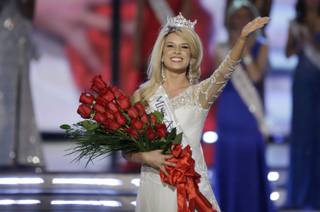 Miss Nebraska Teresa Scanlan, 17, waves after being crowned 2011 Miss America during the Miss America Pageant on Saturday, Jan. 15, 2011,  at Planet Hollywood.
