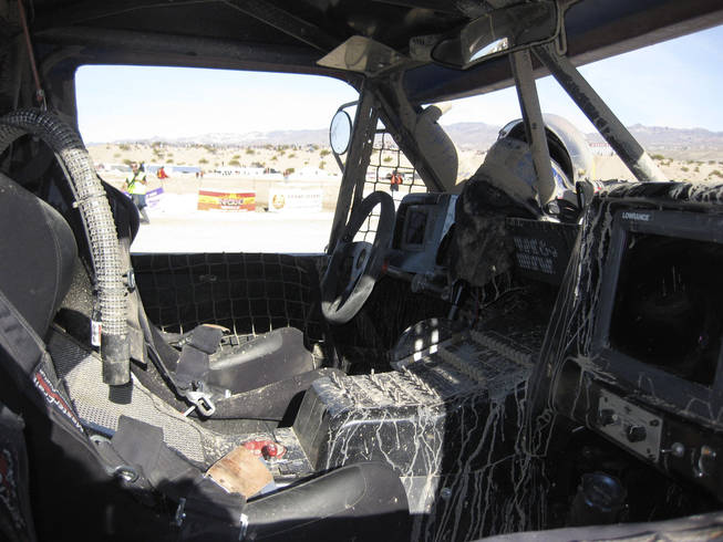 This the cab of a Trophy-Truck after completion of the race.  Note the streaks of mud inside the cab. 