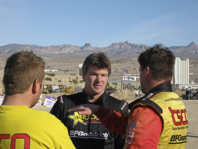 Rob MacCachren talks with a few drivers after the race.