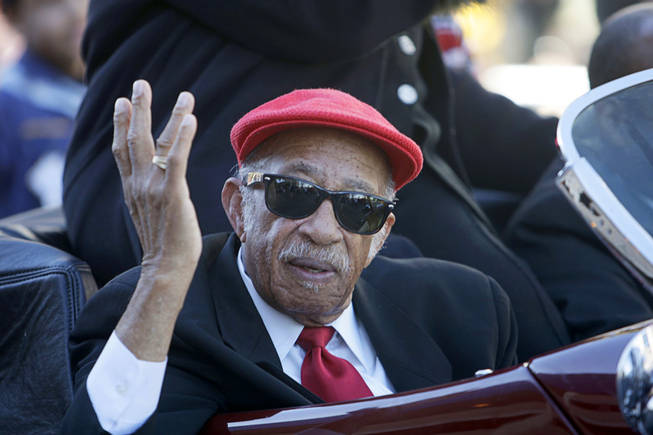 Longtime educator and former North Las Vegas City Councilman Theron Goynes, one of the parade's grand marshals, waves from a car during the Martin Luther King Jr. Day Parade in downtown Las Vegas January 17, 2011. 