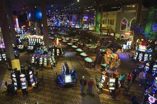 A couple walks though the casino floor at Buffalo Bill's in Primm on Thursday, Jan. 20, 2011. The casino recently replaced older light bulbs with energy-efficient lighting throughout the casino. 