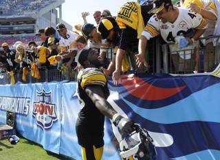 Pittsburgh Steelers linebacker Stevenson Sylvester (55) celebrates with Steelers fans after defeating the Tennessee Titans 19-11 in game on Sunday, Sept. 19, 2010, in Nashville, Tenn.