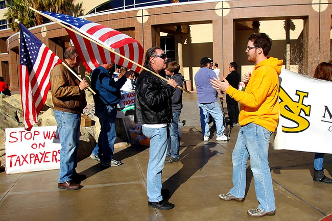 Gov. Brian Sandoval supporter Dave Roberts, left, and Nevada State College alumnus Matt Mitchell discuss their differing views during a town hall meeting at the Grant Sawyer Building to hear citizens' concerns about Sandoval's proposed budget Saturday, January 29, 2011.