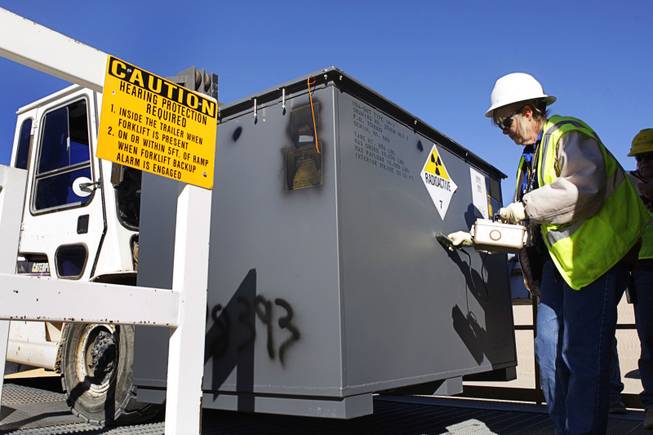 Pam Salvato, a radiation control technician, surveys a container for contamination in the Area 5 Radioactive Waste Management Site of the Nevada National Security Site (N2S2), previously the Nevada Test Site, about 65 miles northwest of Las Vegas, on Feb. 1, 2011. 