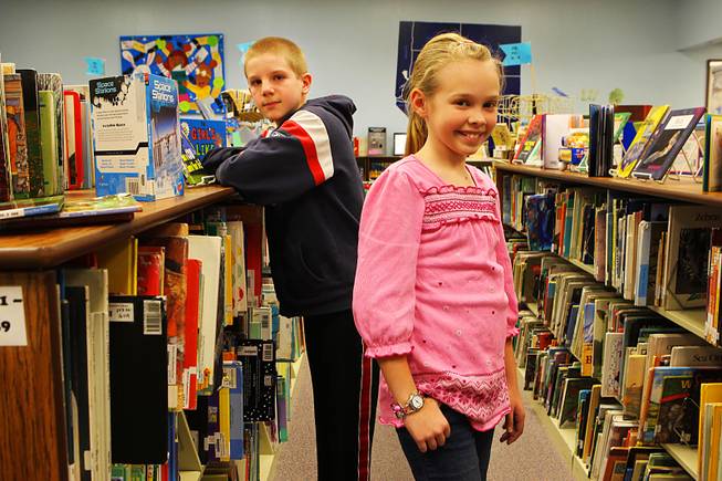 Adam Wozniak and Aubrey Stubbs, fifth-graders at Martha P. King Elementary School, pose in the library Feb. 1, 2011.